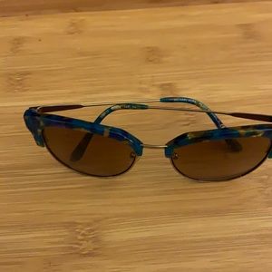 Michael Kors gold and tortoise sunglasses.